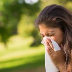 a woman sneezing