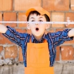 a child pulling out a tape measure