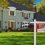 sold sign by a house