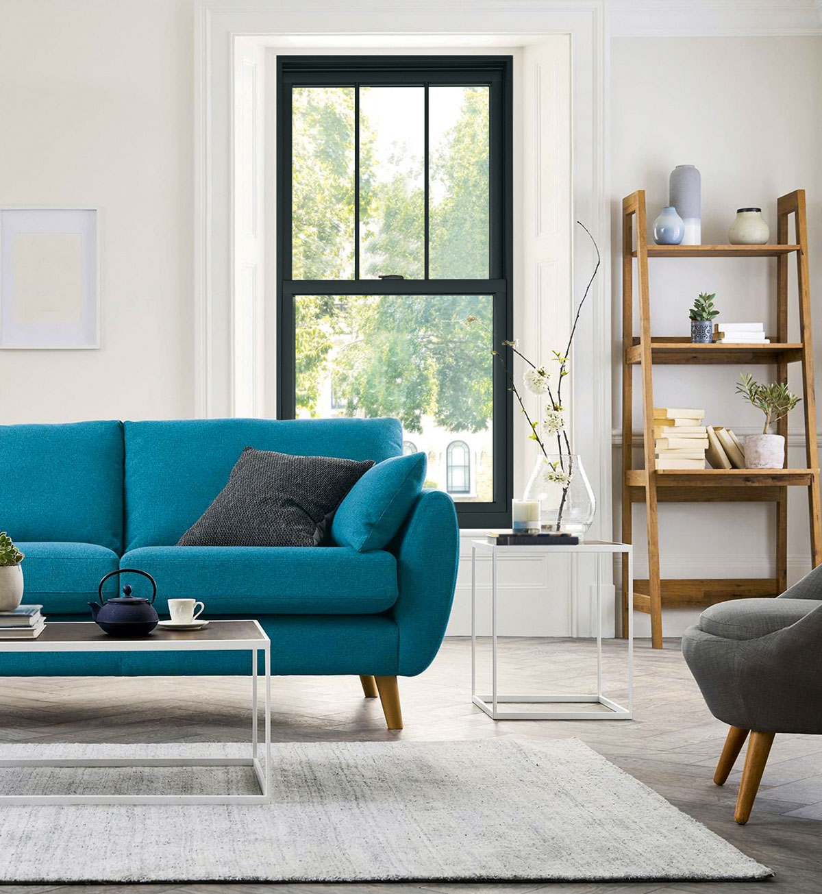 living room with blue couch and black window