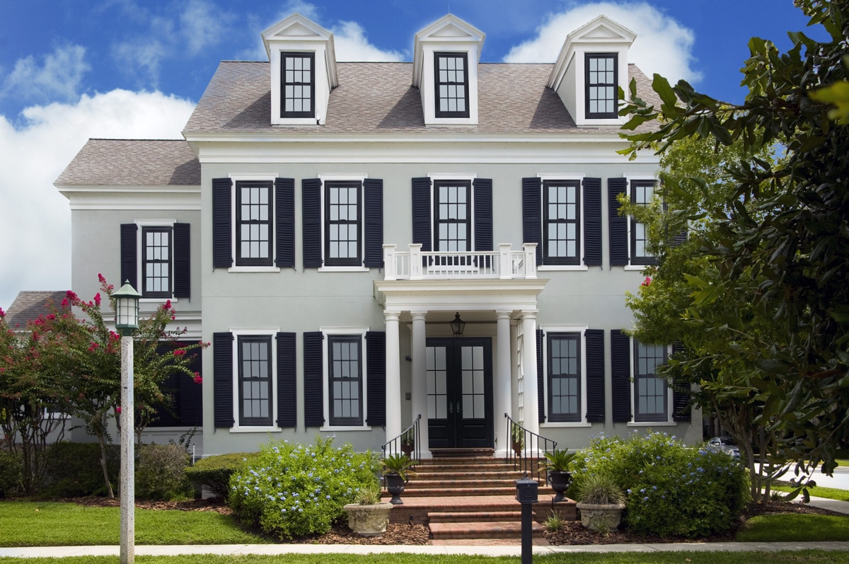 colonial home with black windows