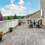 patio with flowers and a table